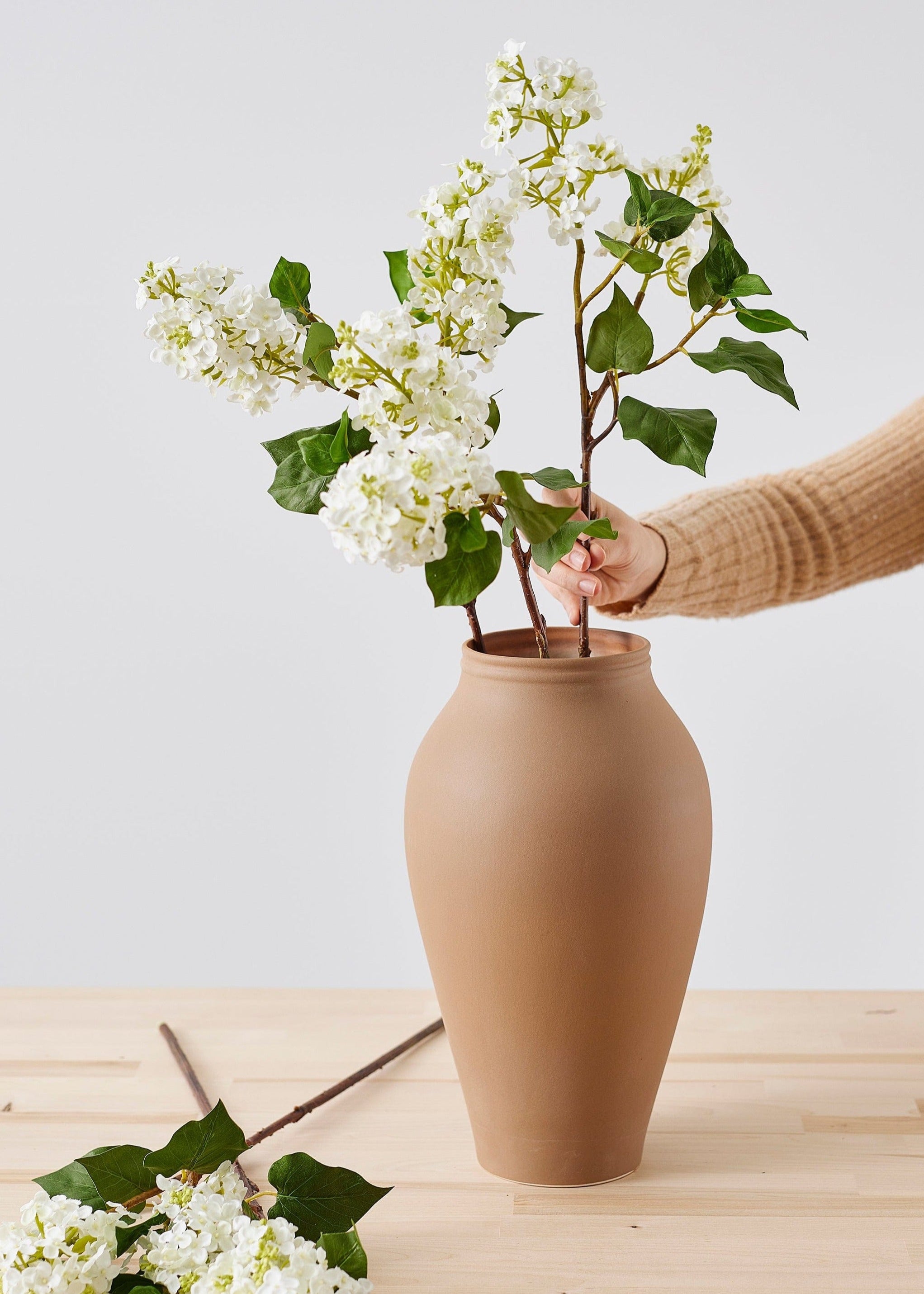 hairpin flower frog arrangement with faux lilacs from afloral