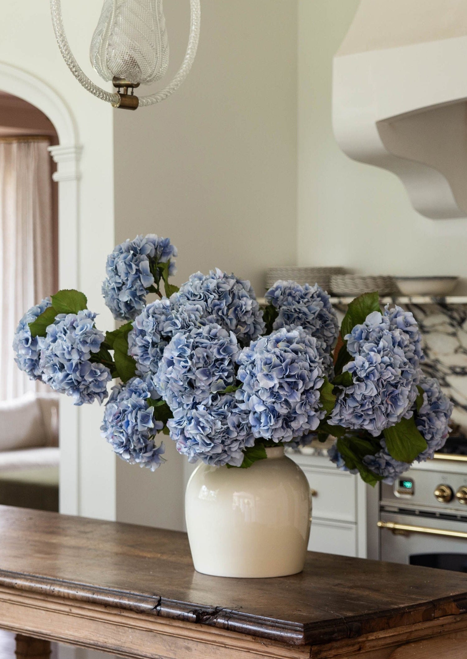Blue Faux Hydrangeas in Cream Glossy Vase from afloral