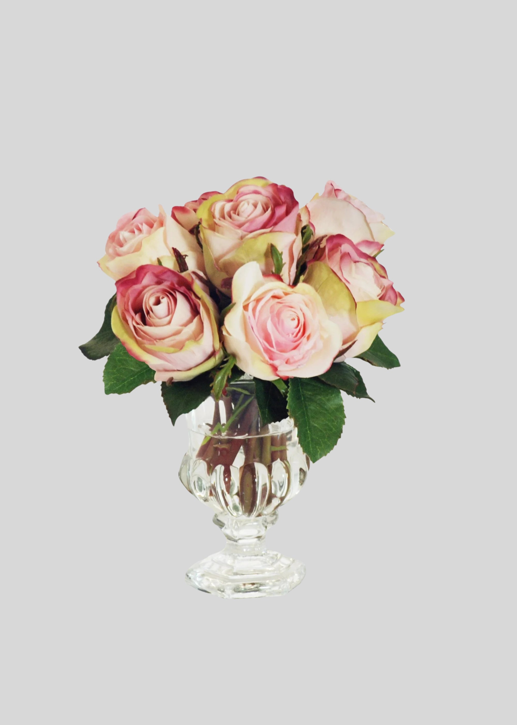 Artificial Pink Roses in a Glass Vase