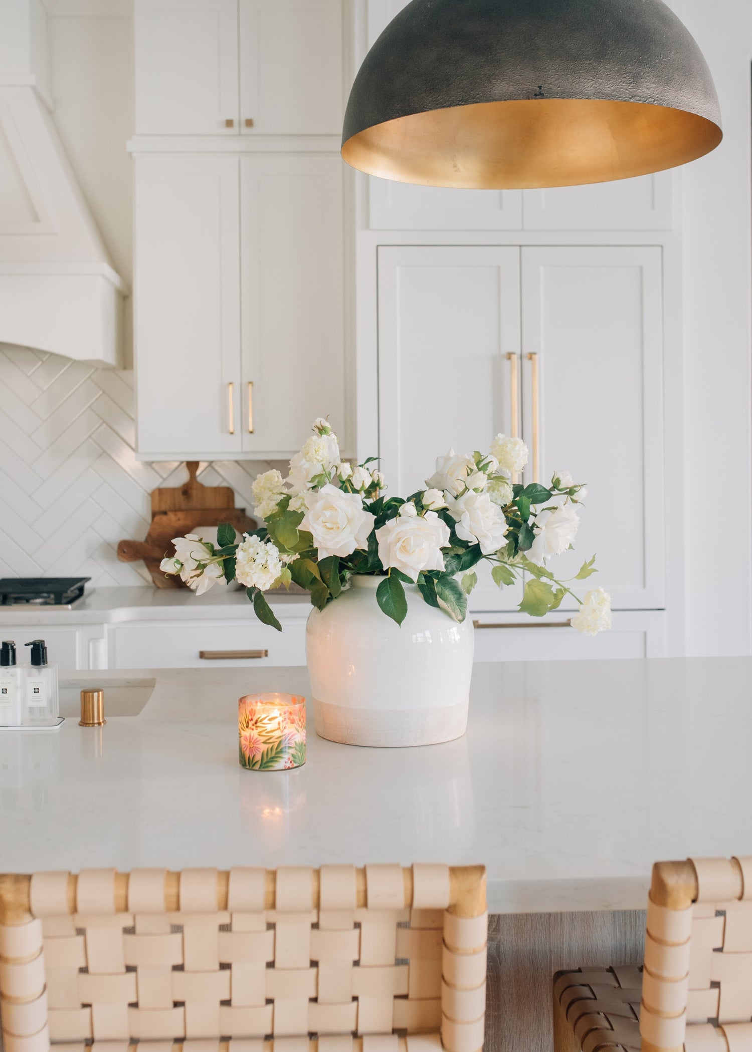 white Roses and Snowballs Arranged in Clay Vase