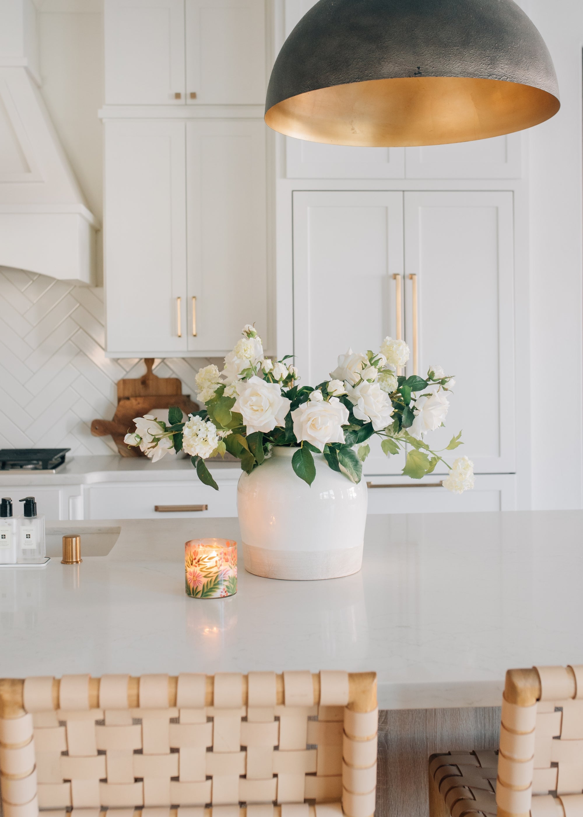 white Roses and Snowballs Arranged in Clay Vase