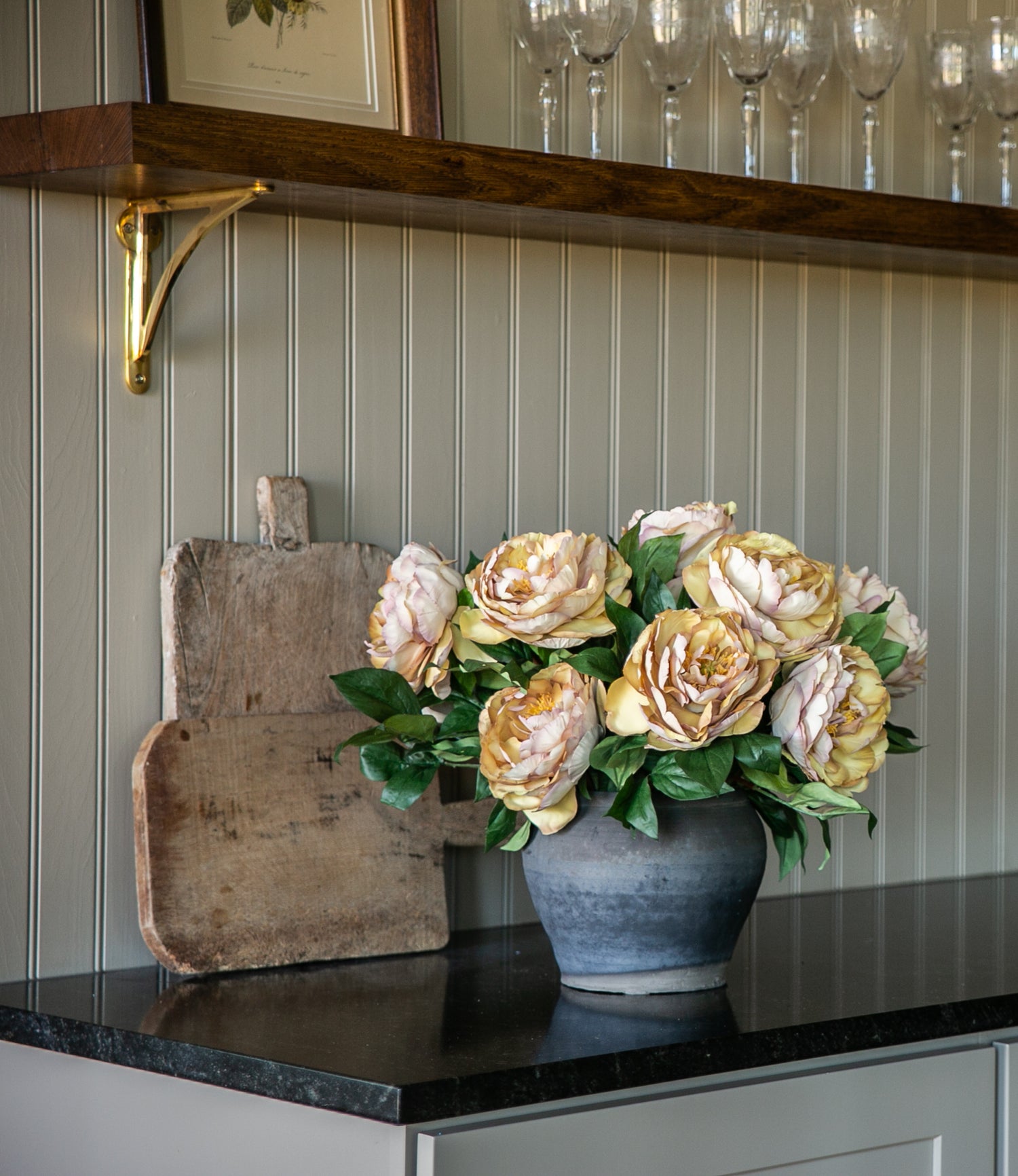 Peony flowers in stone vase