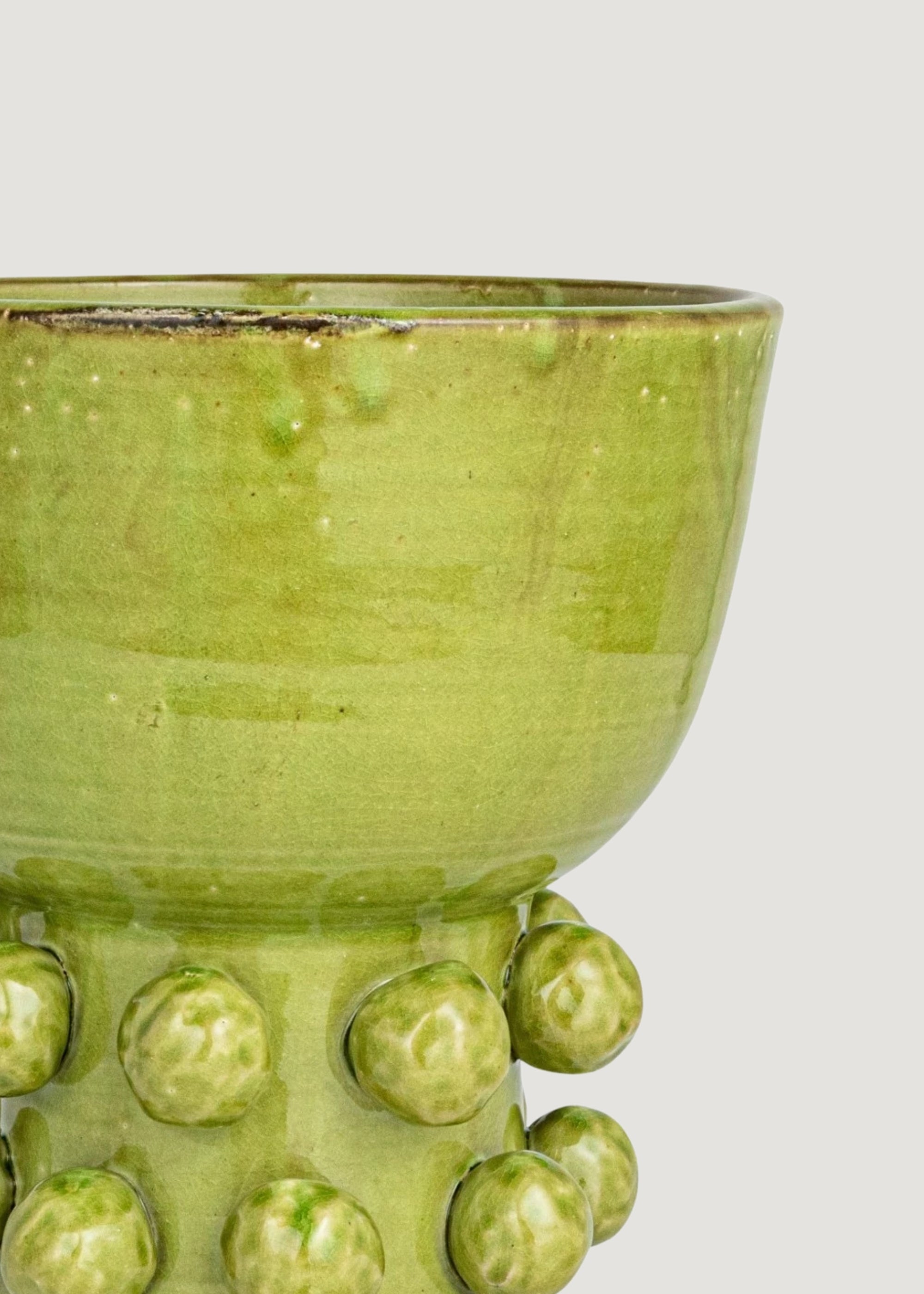 Close-up of Glazed Green Hobnail Vase