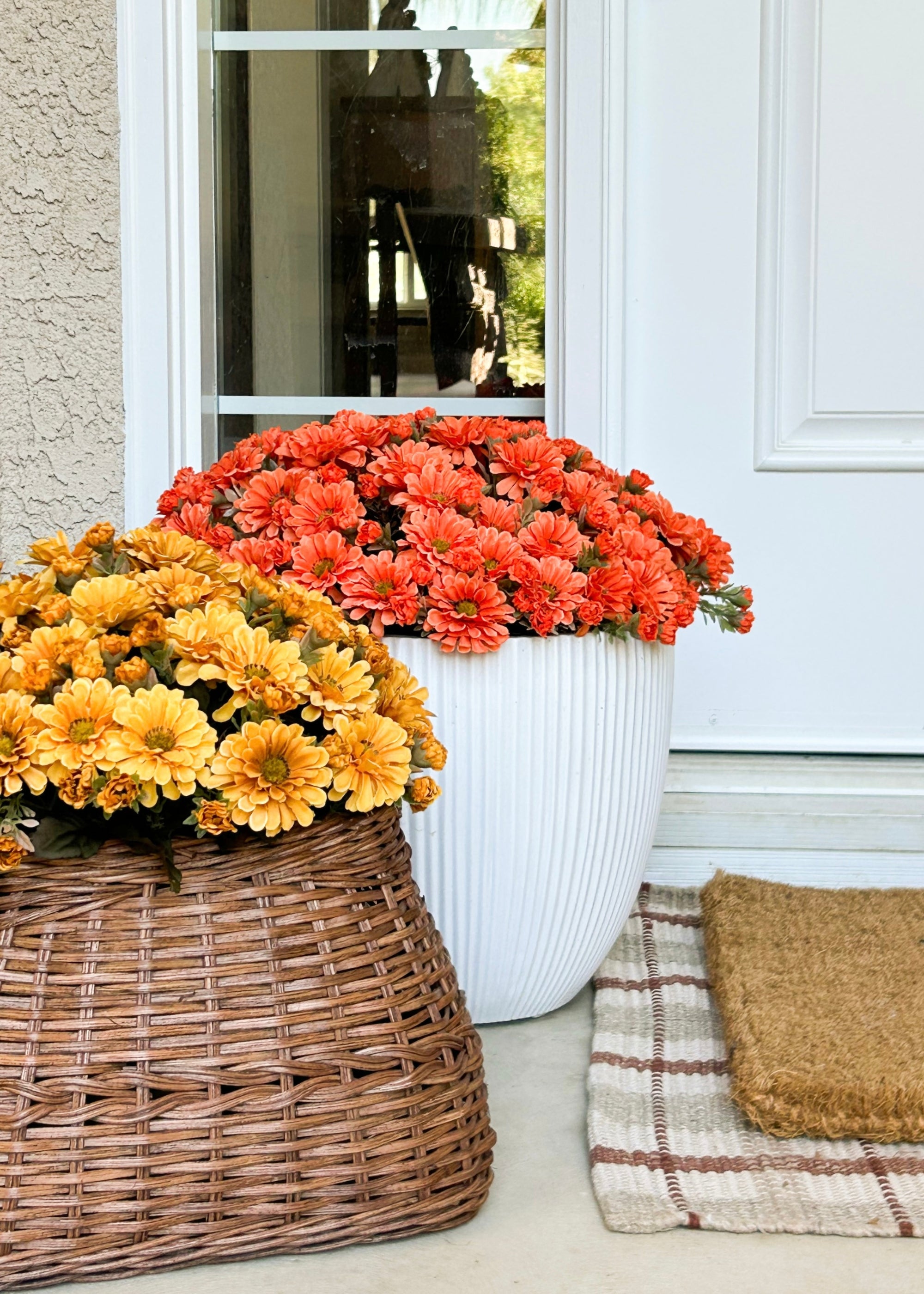 Artificial Mums Arranged on Front Porch