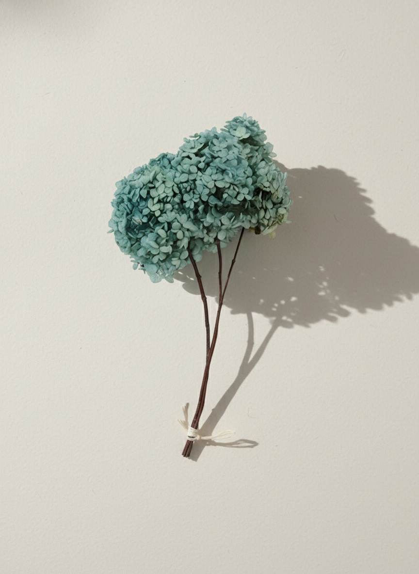 Bouquet of light blue flowers on a beige background