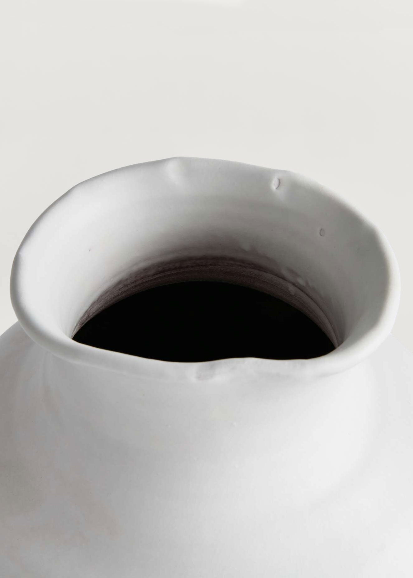Close-up of Matte White Vase Opening