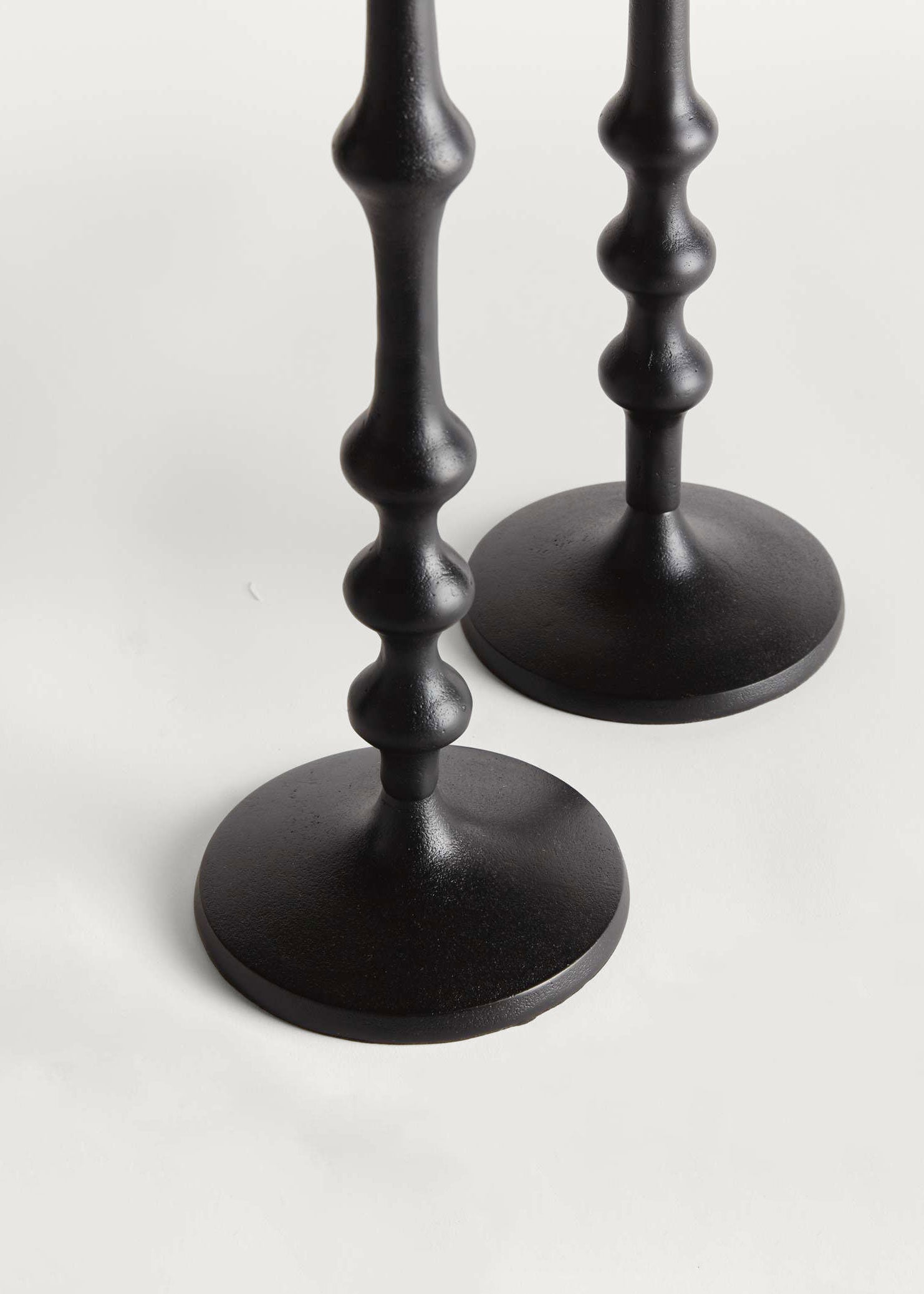 Two black candle holders