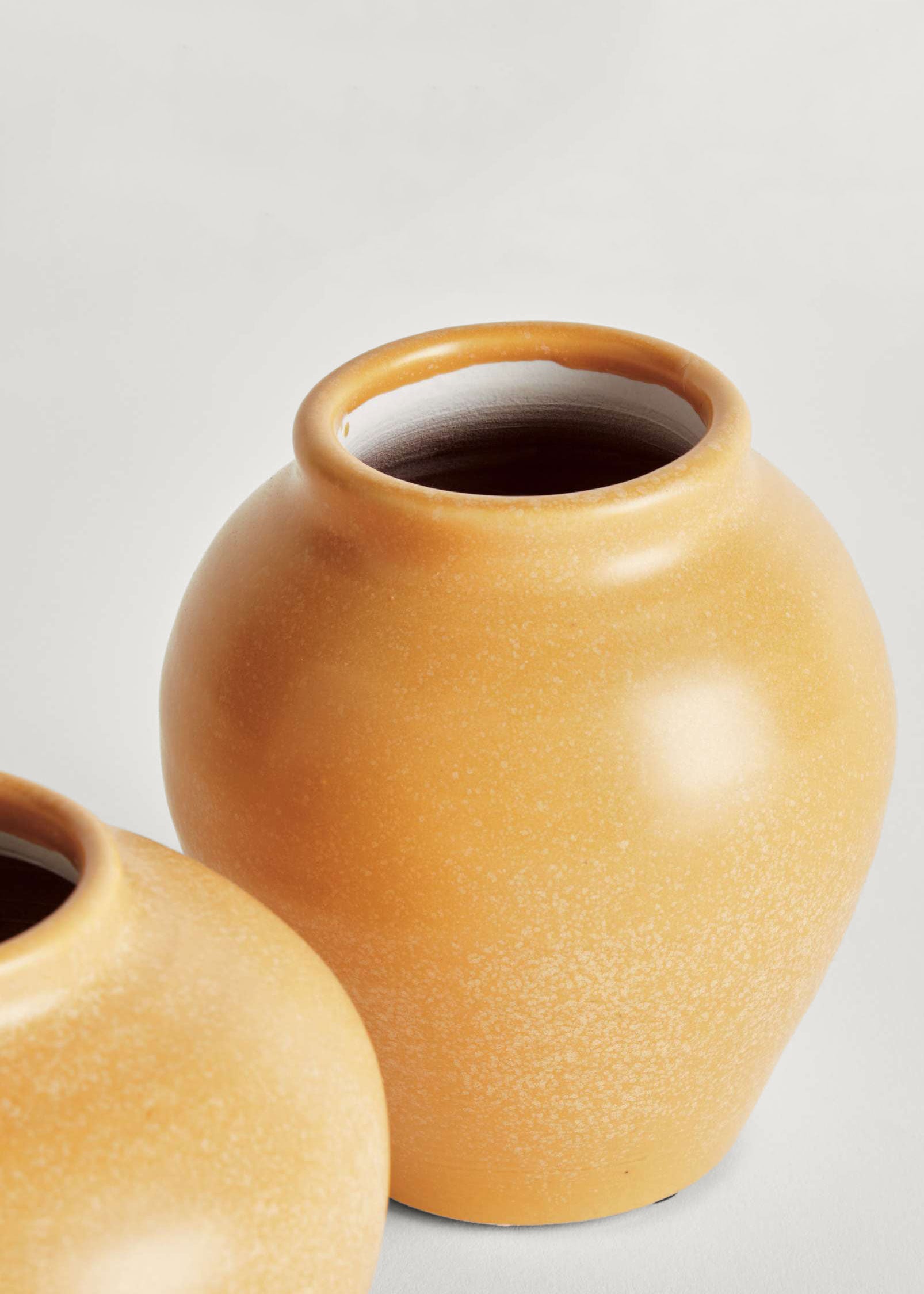 Two ceramic pots with a Yellow Glaze