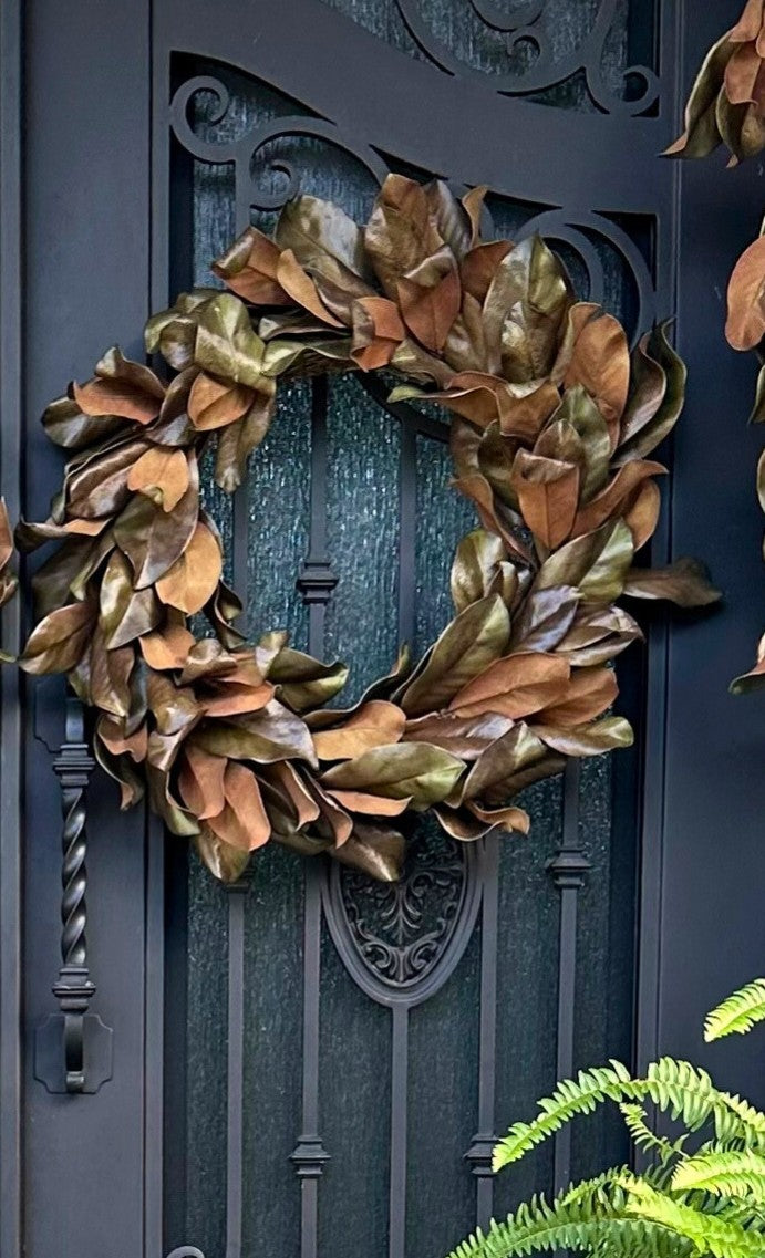 Decorative wreath on a dark blue door with intricate carvings
