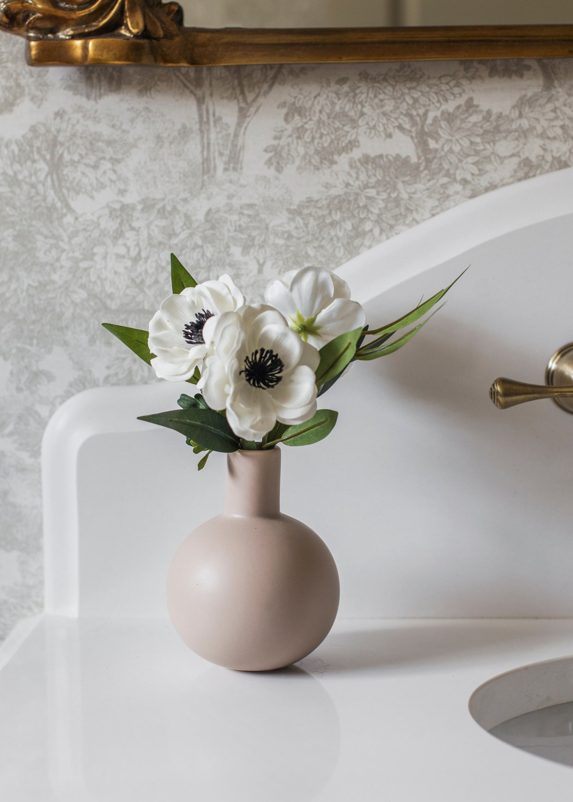 Anemones Arranged in Vase in Bathroom