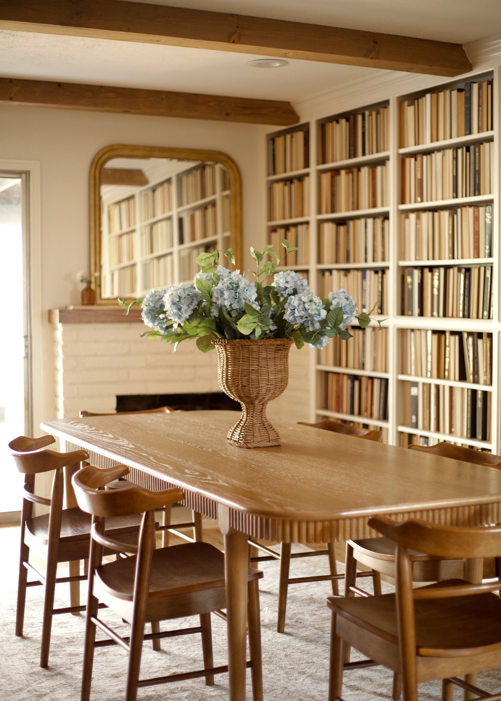 antique blue hydrangeas in a rattan basket base