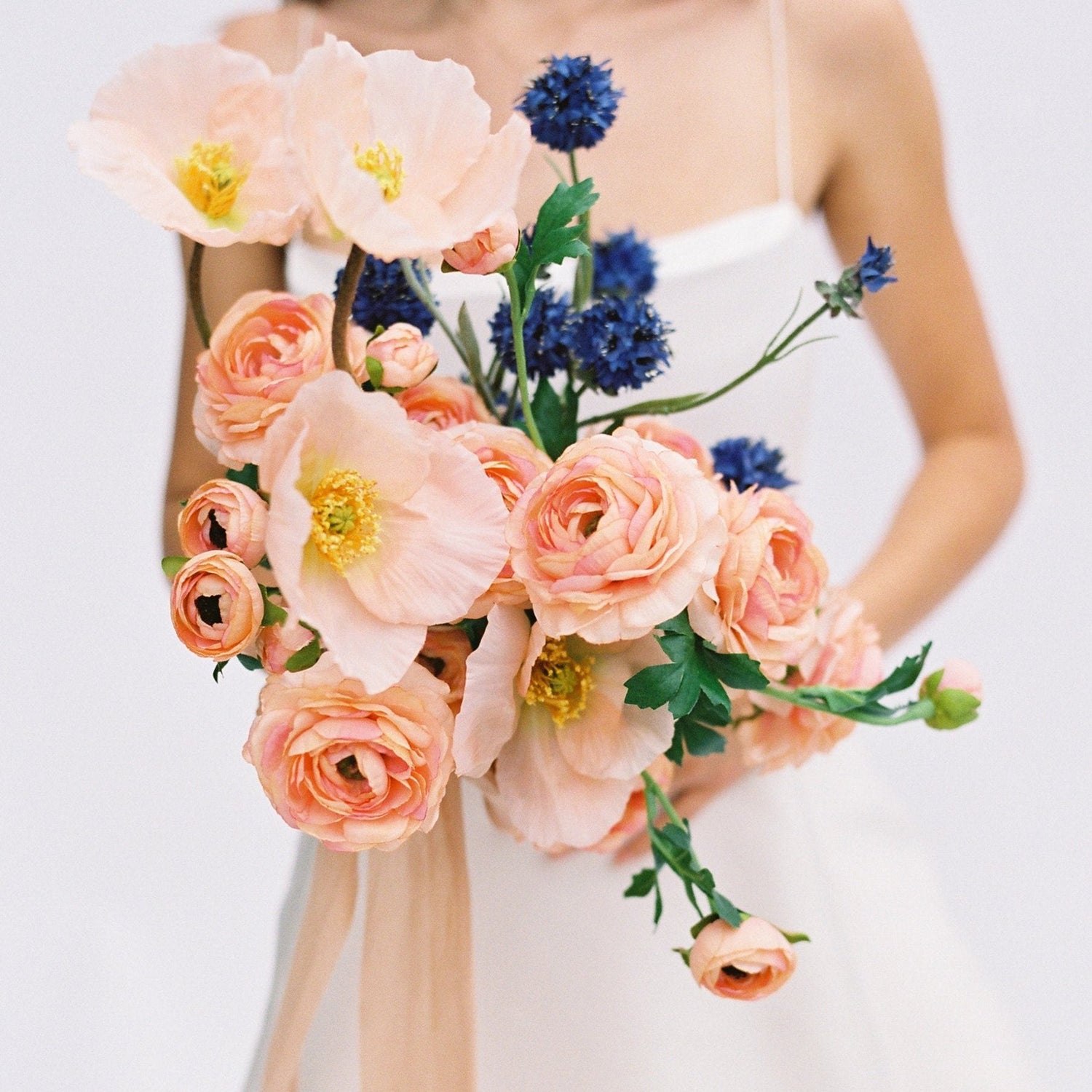 peach wedding bouquet made of silk flowers