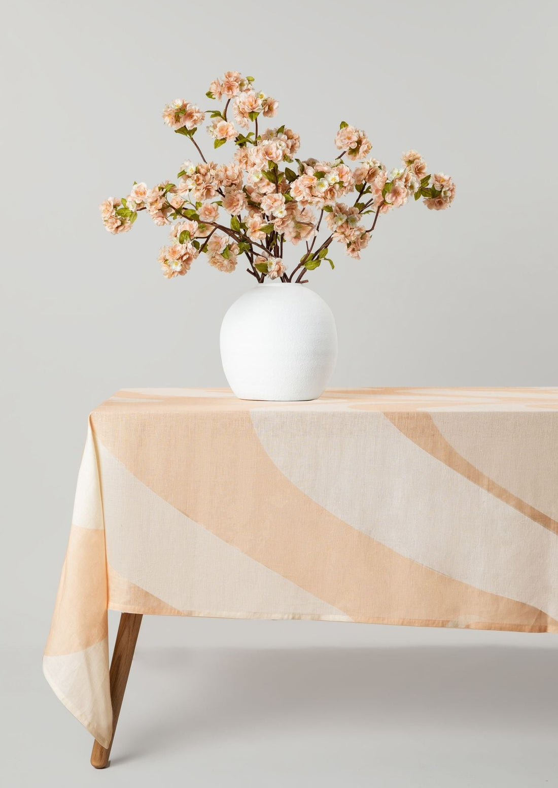 Linen Tablecloth in Sand with Artificial Peach Blossom Arrangement