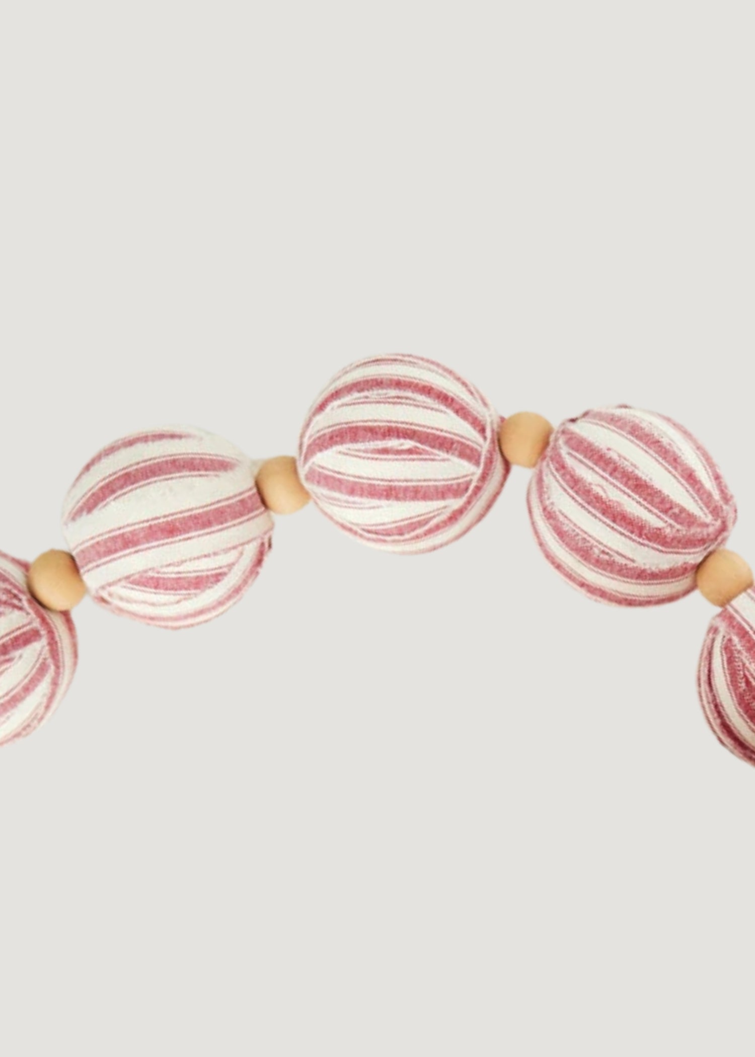 Close-up of a Striped Red and White Holiday Ball Garland