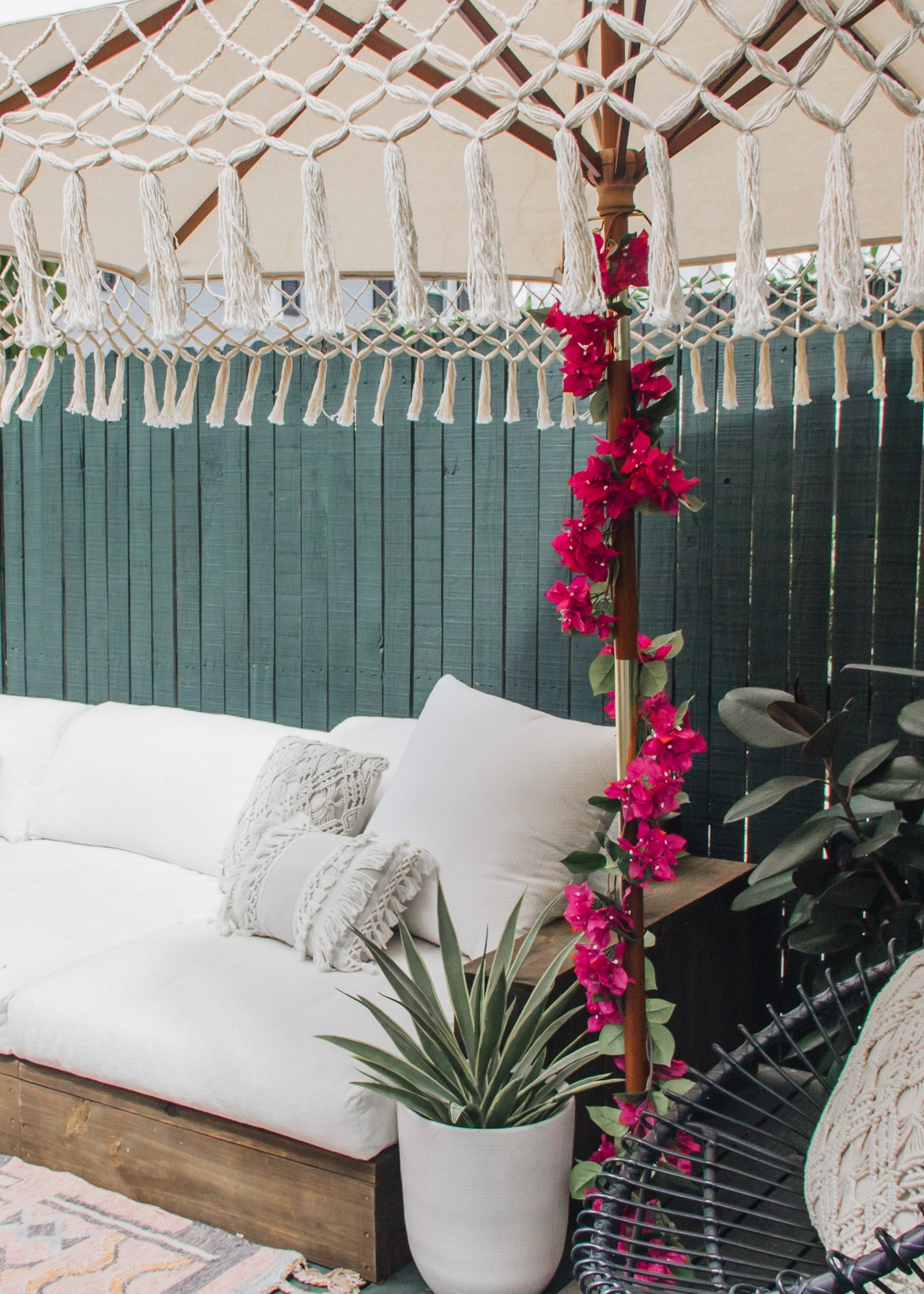 Artificial Bougainvillea Garland wrapped around an Outdoor Umbrella