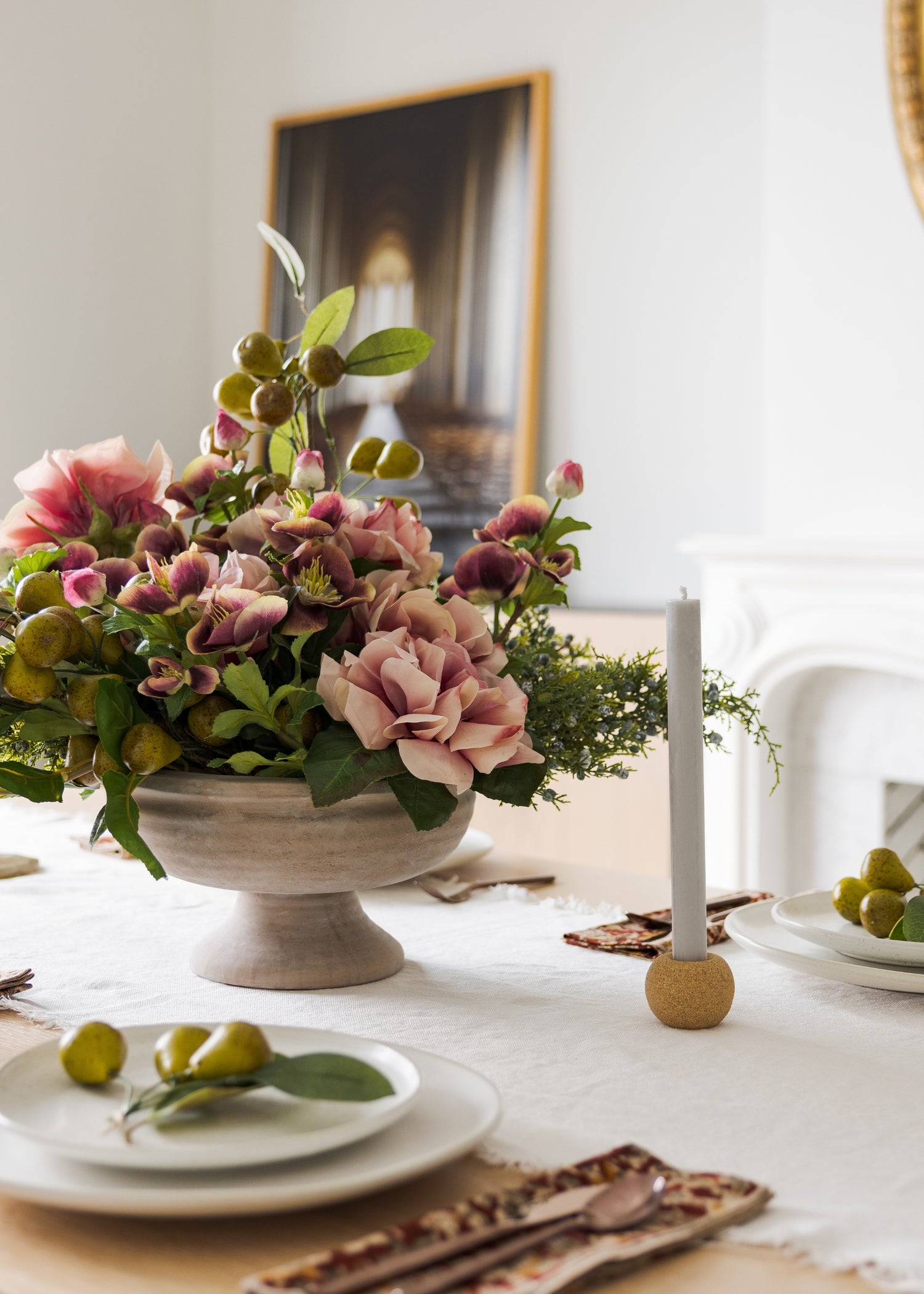 Table centerpiece with faux peonies, pears and helleborus flowers