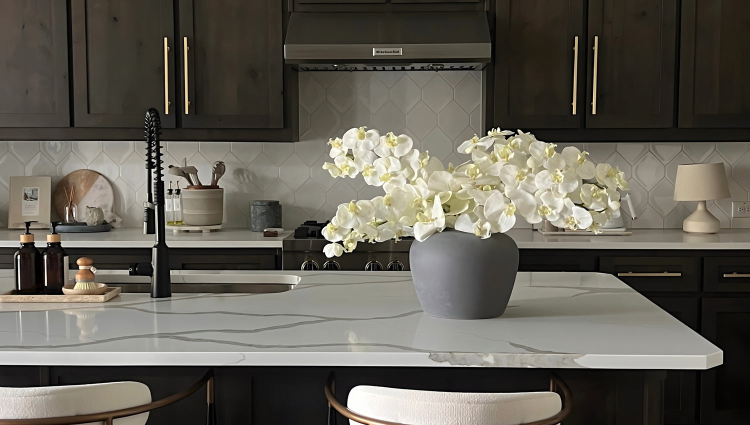 silk orchid arrangement on kitchen counter