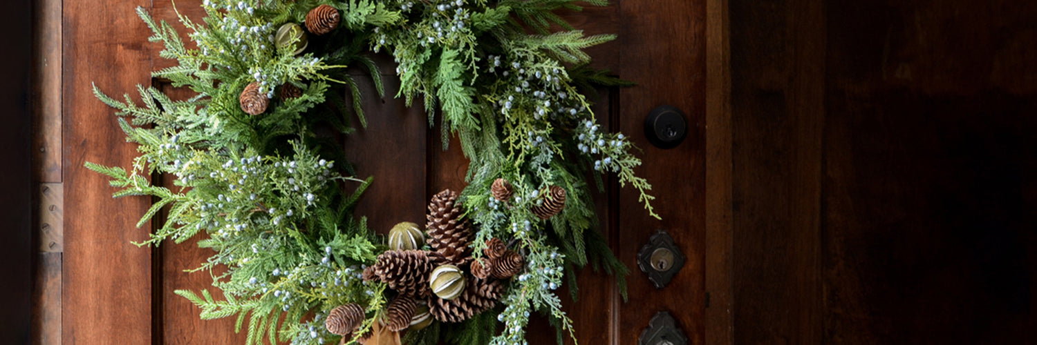 Afloral Norfolk wreath with juniper and pine cone accents