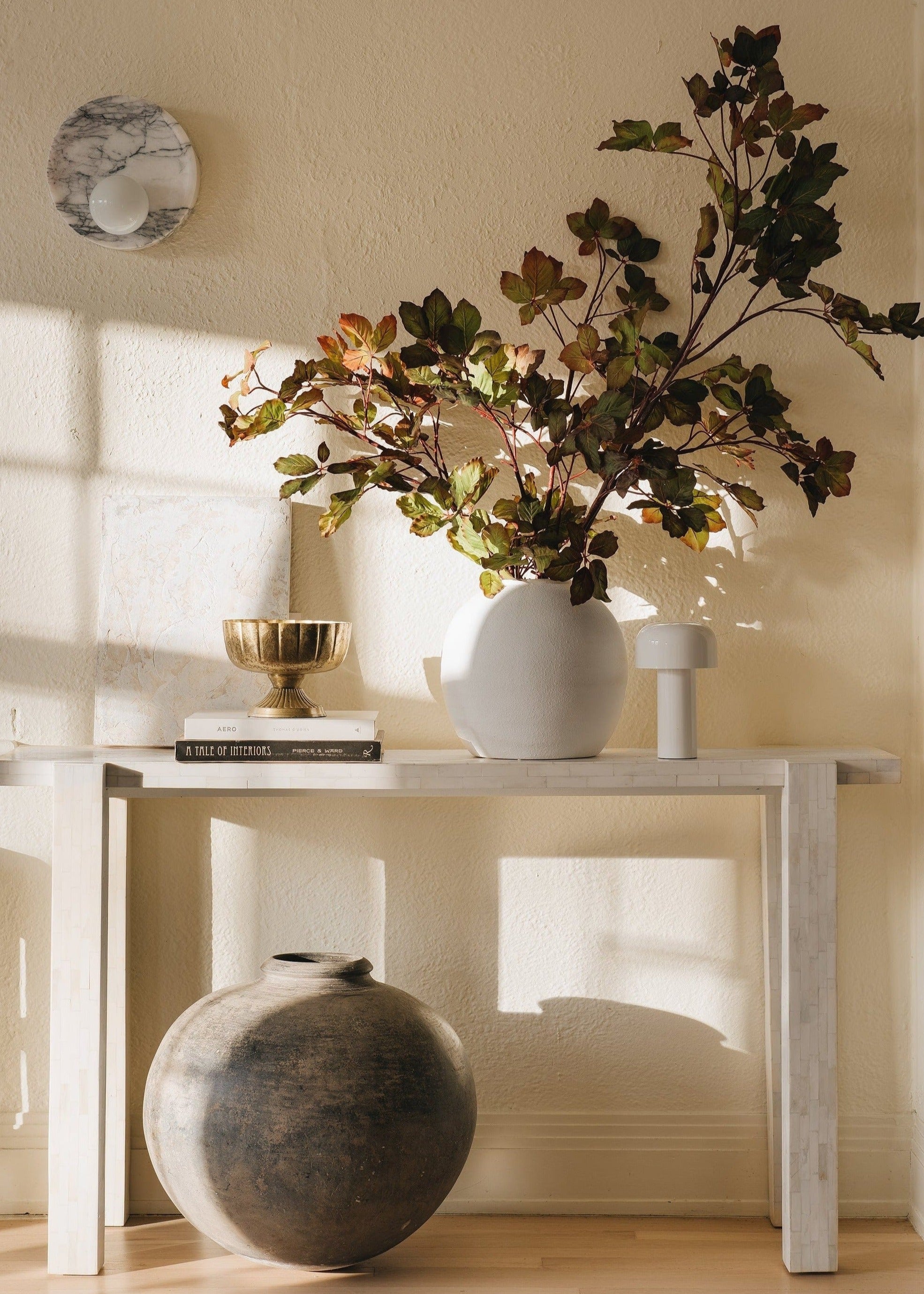 White Konos Vase Styled with Artificial Branches at Afloral