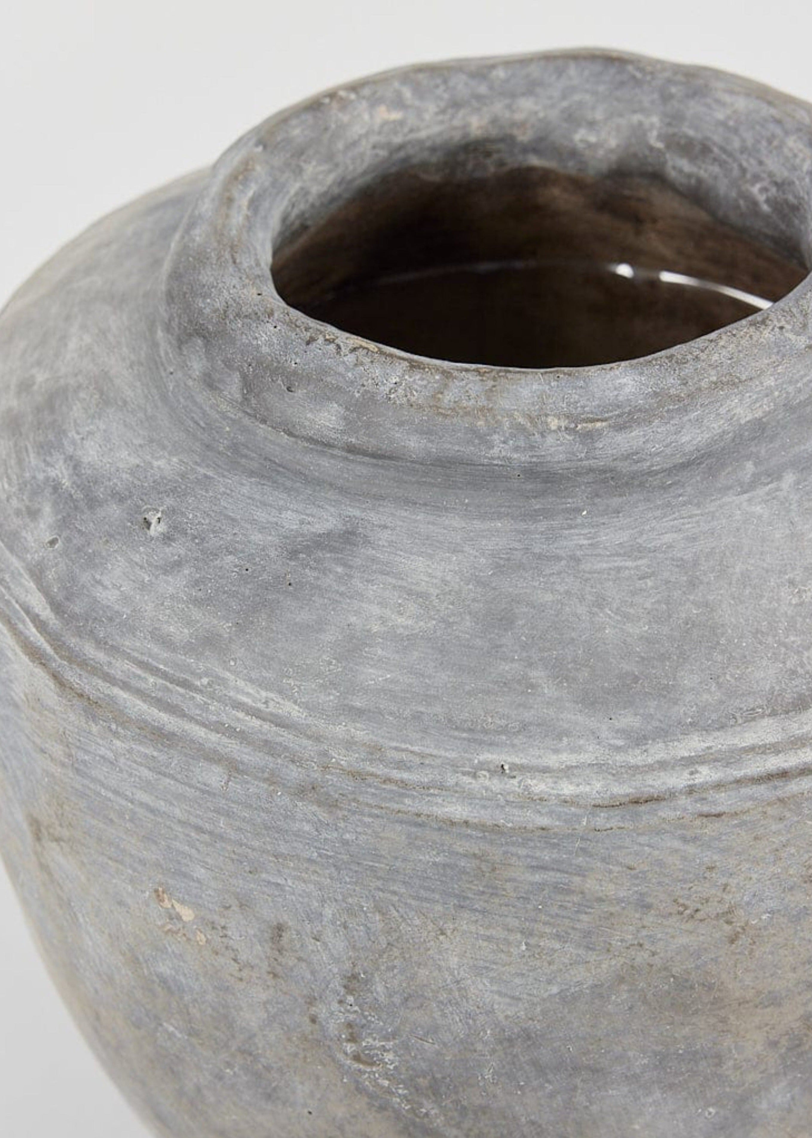 Close Up of Large Distressed Concrete Vase in Gray at afloral