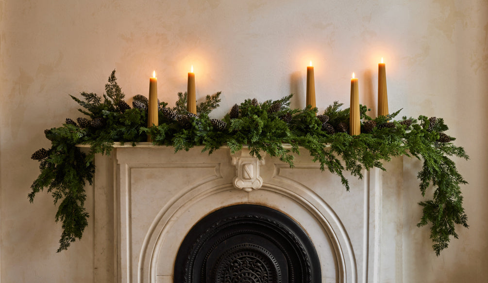 how to style a mantel with christmas garland