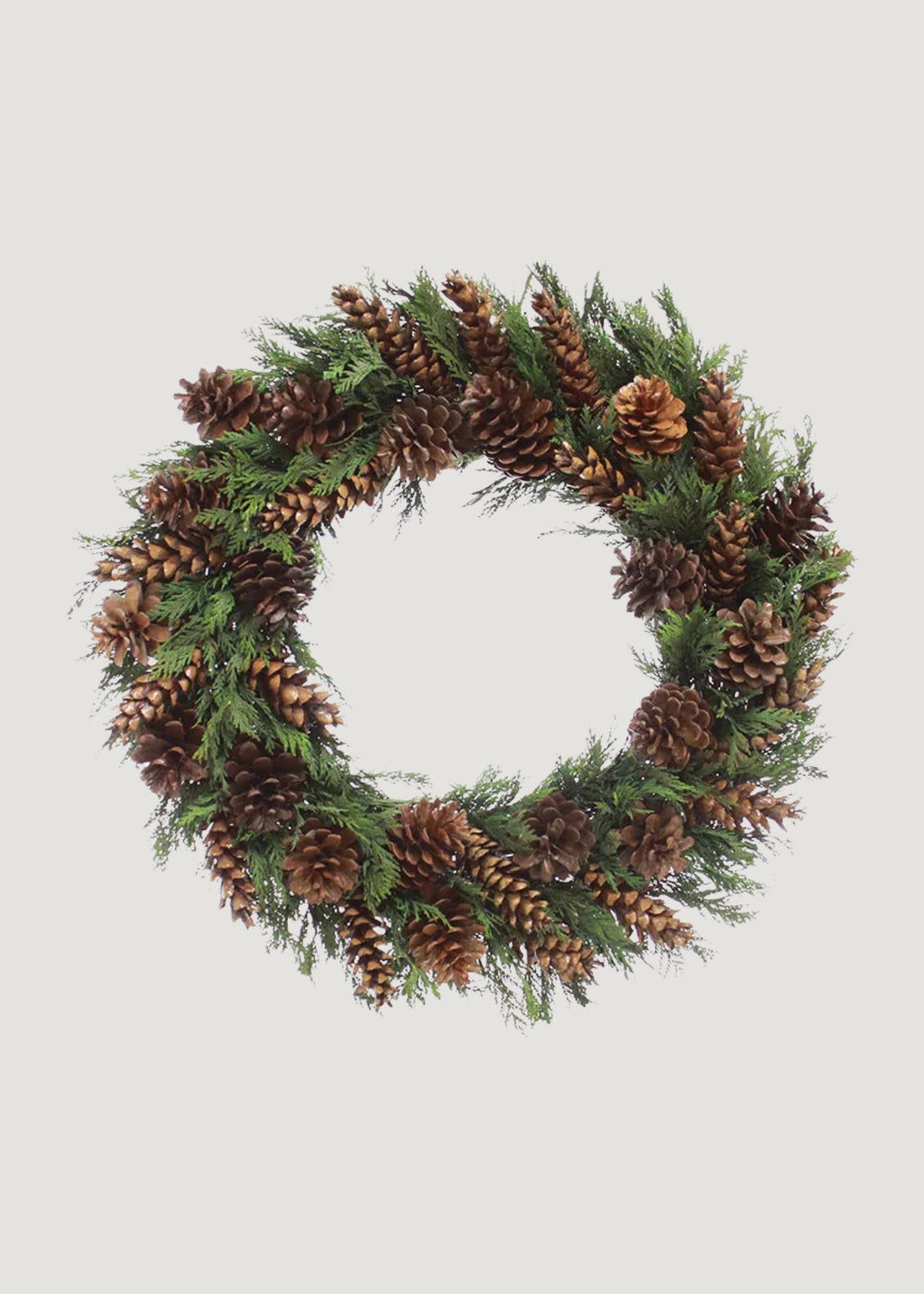 An outdoor pinecone wreath for holiday charm.