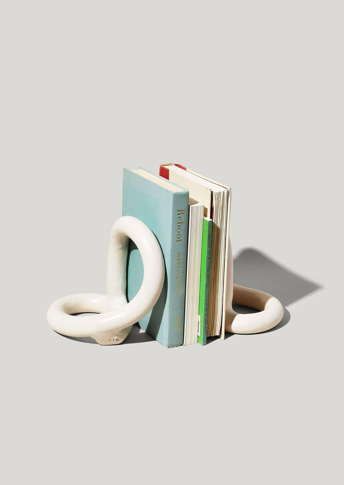 Set of 2 Cream Stoneware Bookends Styled with Books at Afloral
