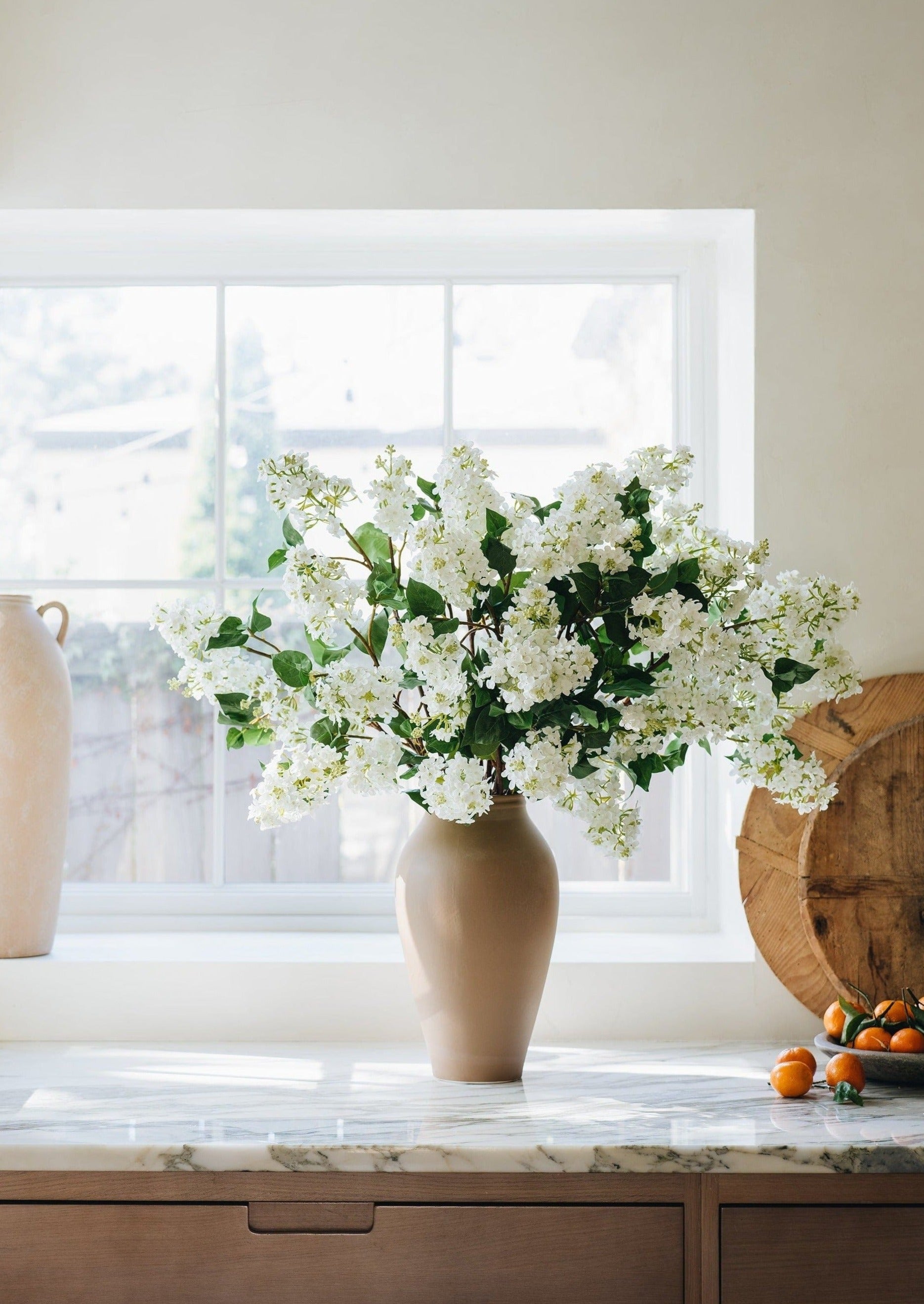 White Artificial Lilac Flowers in Afloral Terracotta Vase