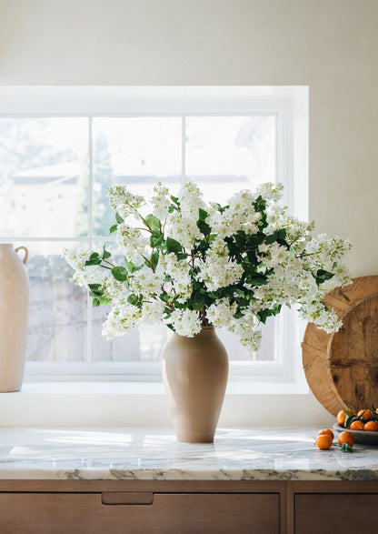 White Artificial Lilac Flowers in Afloral Terracotta Vase