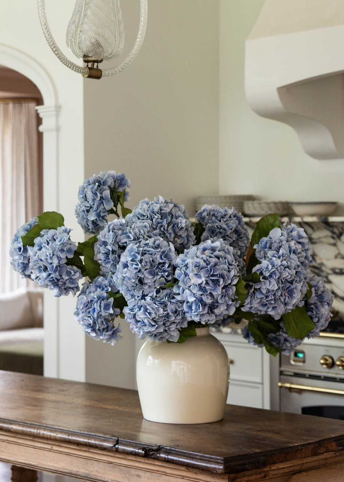 Blue Faux Hydrangeas in Cream Glossy Vase from afloral