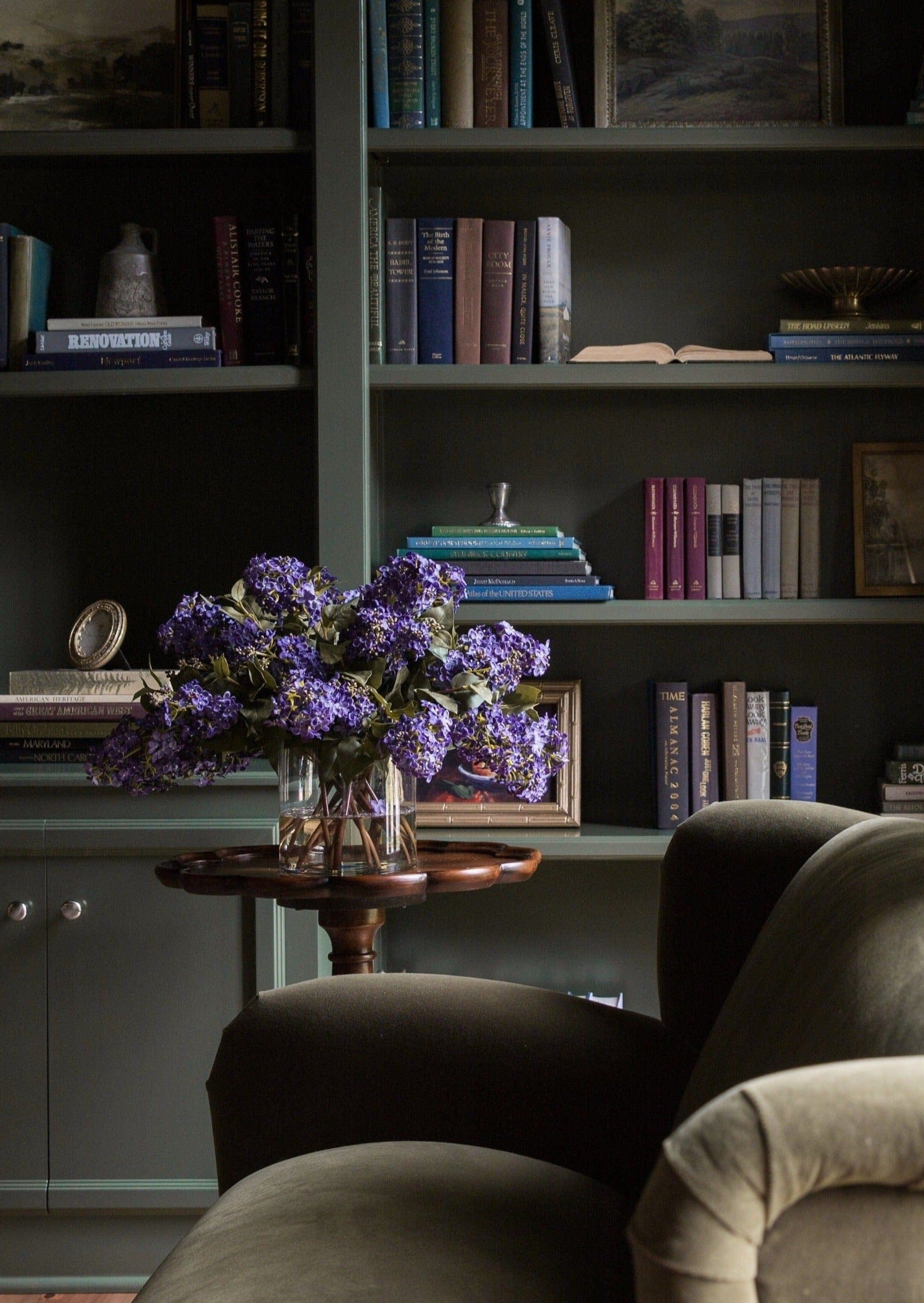 artificial flower arrangement of purple lilacs at afloral