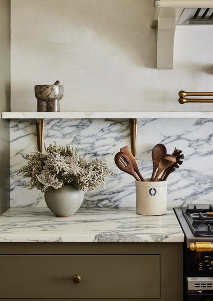 german statice and vase in kitchen at afloral