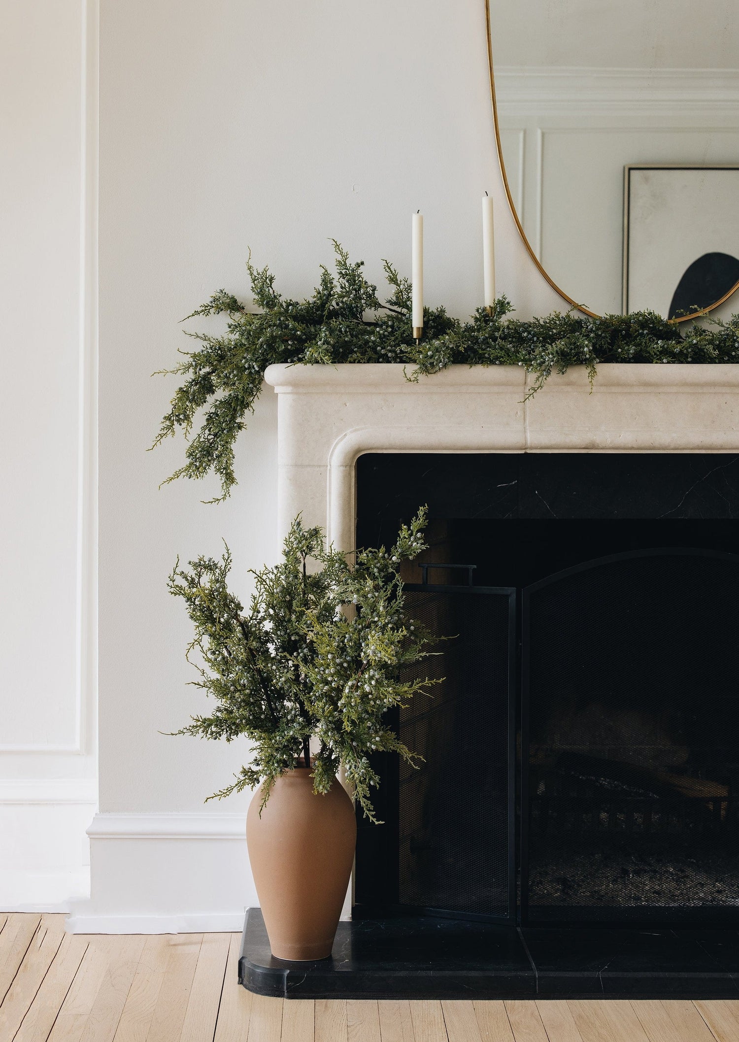 Faux Holiday Juniper Branches in Terracotta Vase