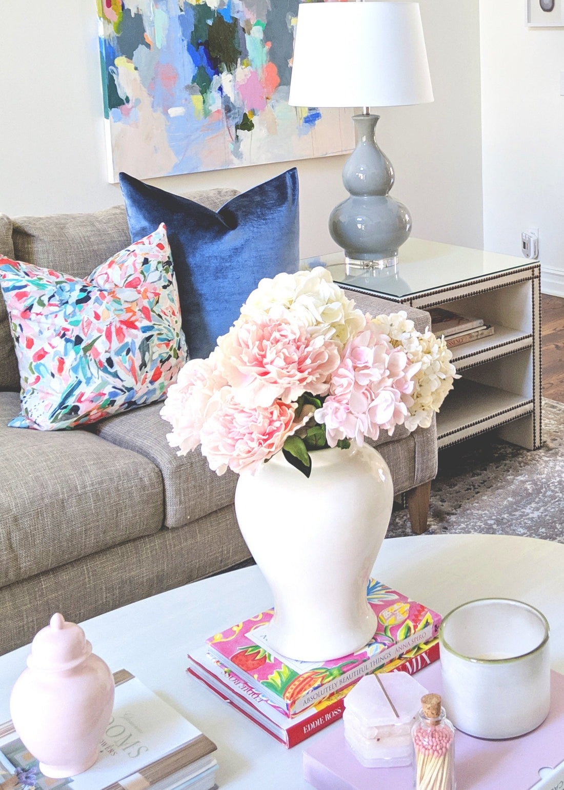 White ginger jar styled with faux flowers