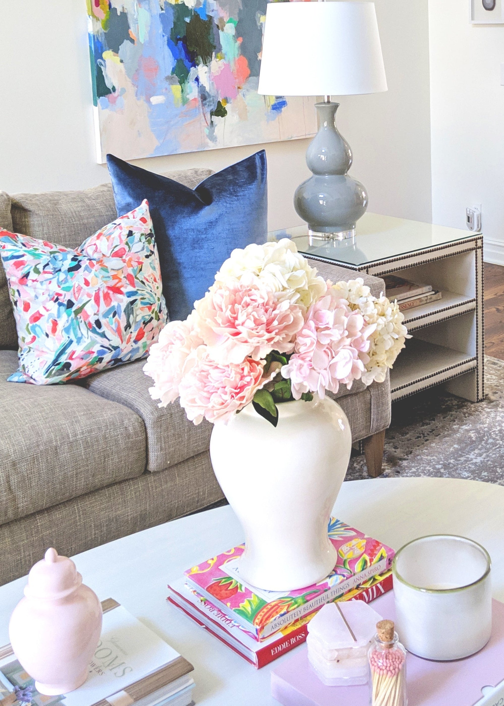 White ginger jar styled with faux flowers