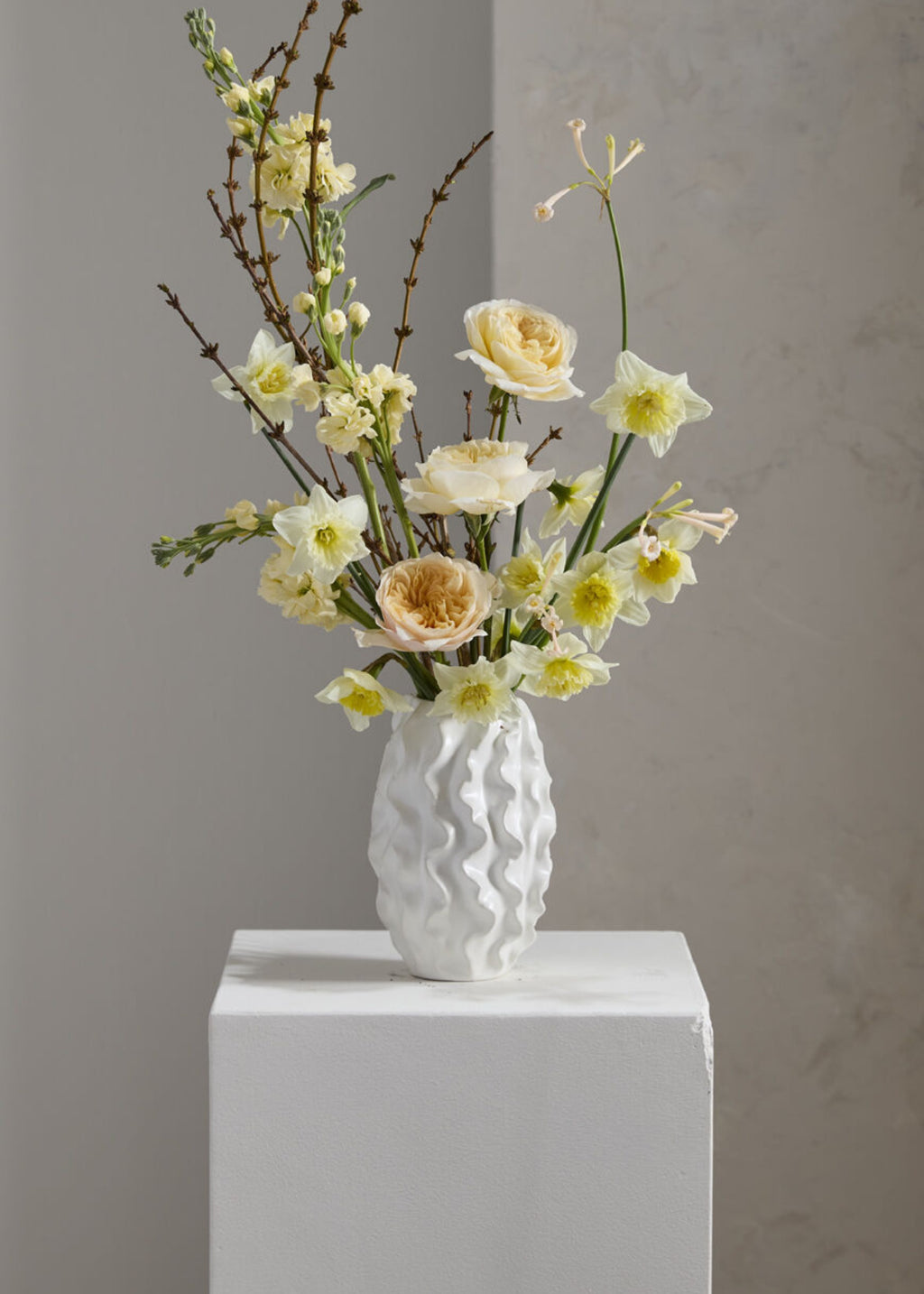 White textured vase with flowers 
