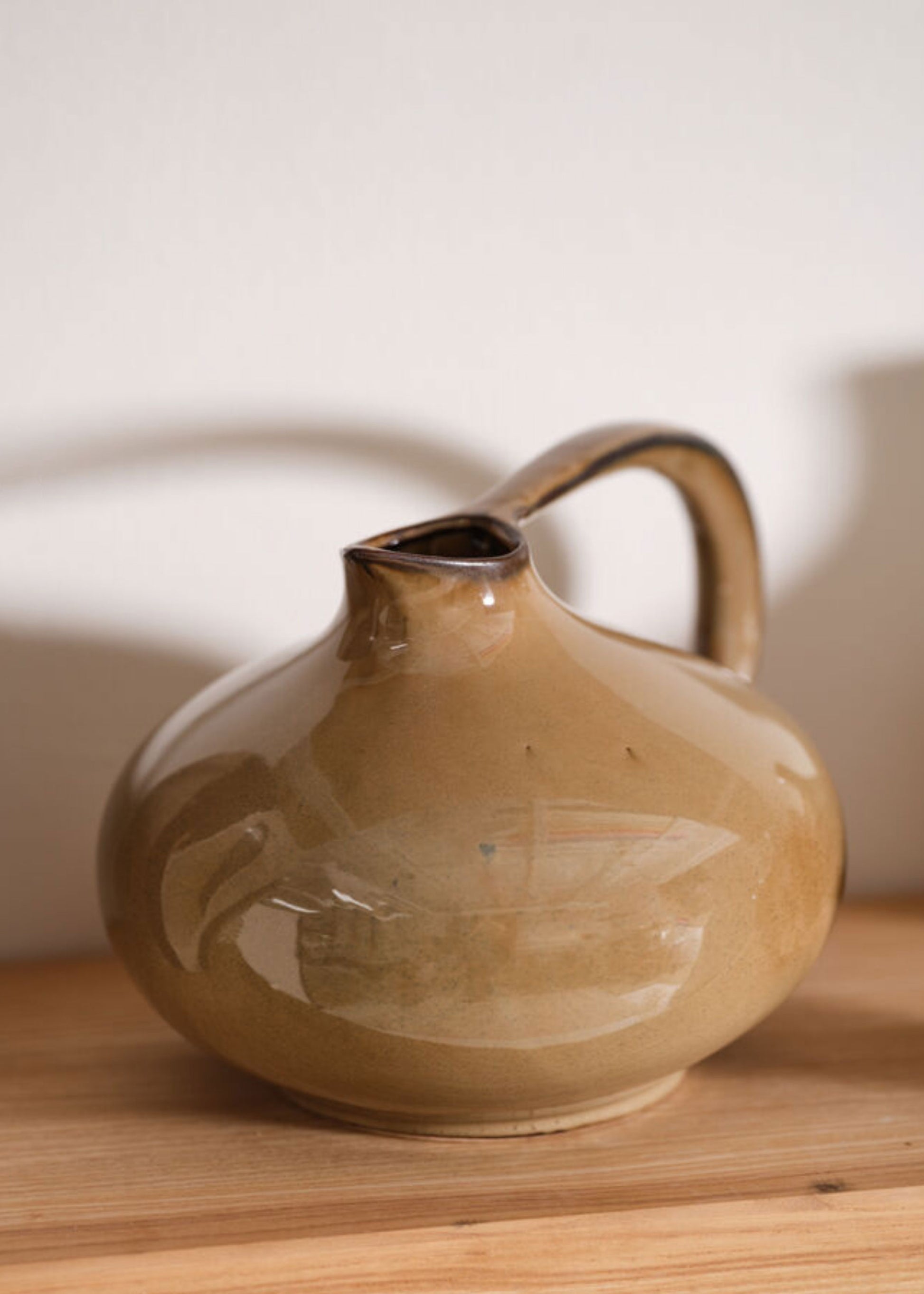 Brown ceramic pitcher 
