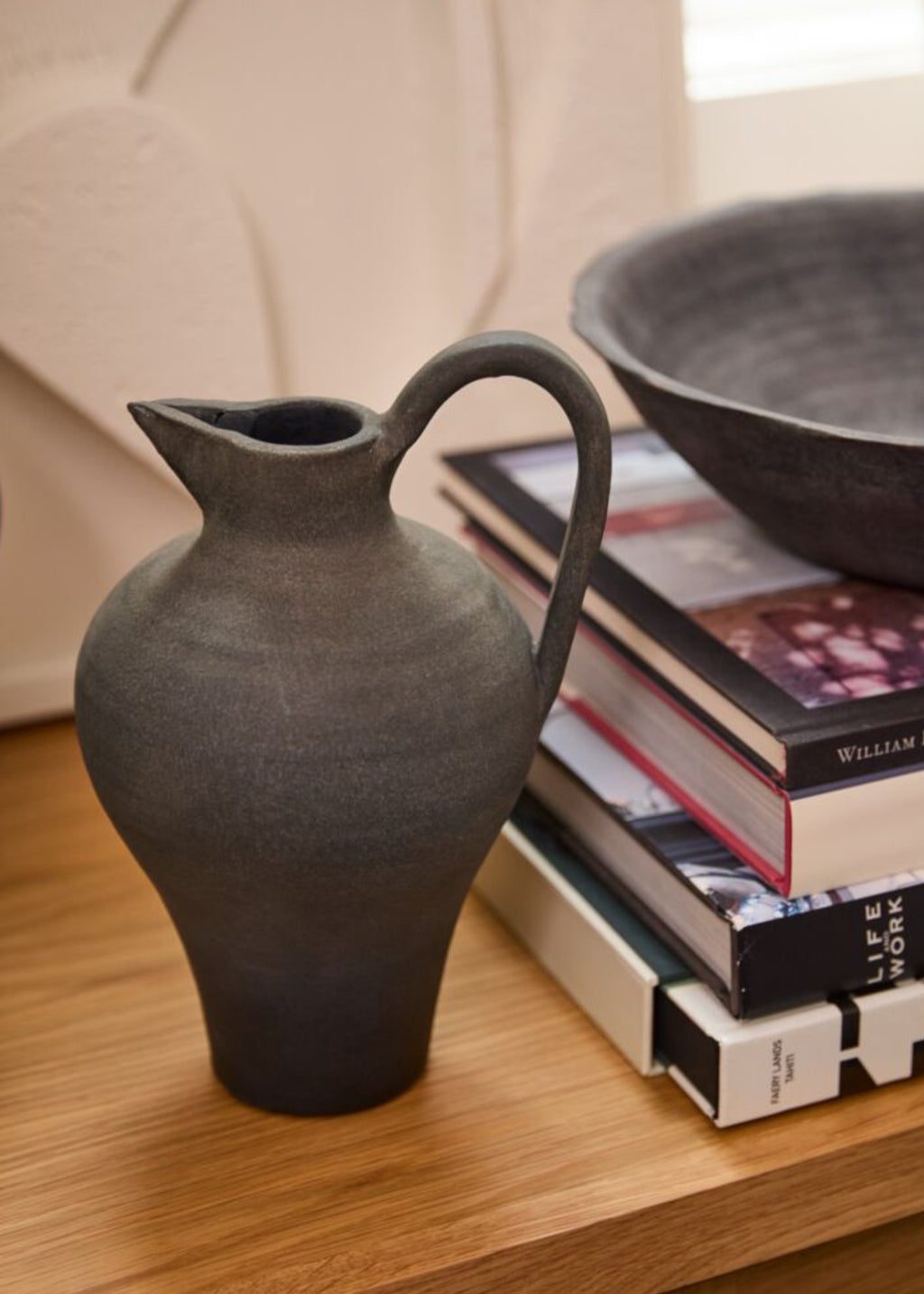 handmade terra cotta pitcher on shelf