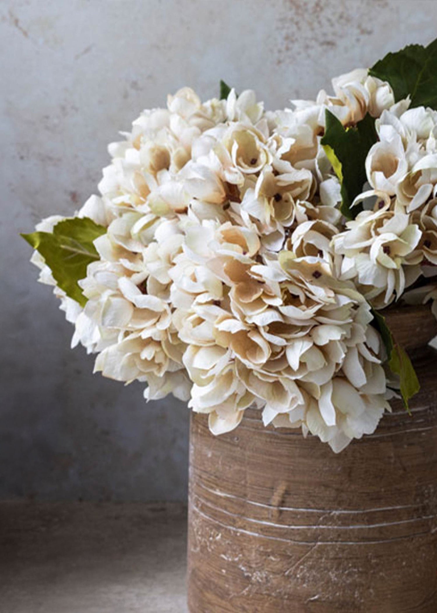 arrangement of faux beige hydrangeas