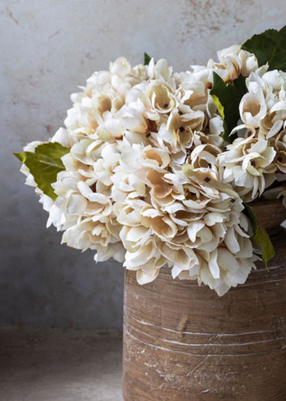 arrangement of faux beige hydrangeas