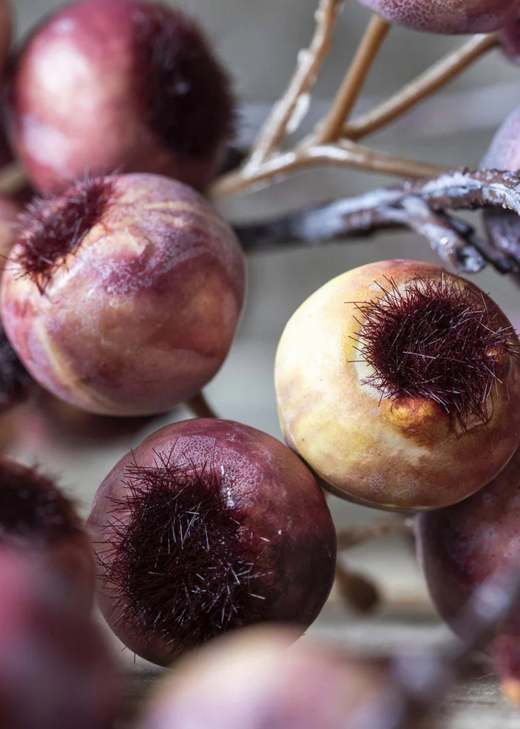 Close-up of artificial Hawthorn berries in pink