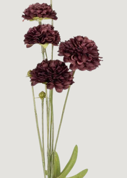 Close-up of deep purple faux clove flower spray