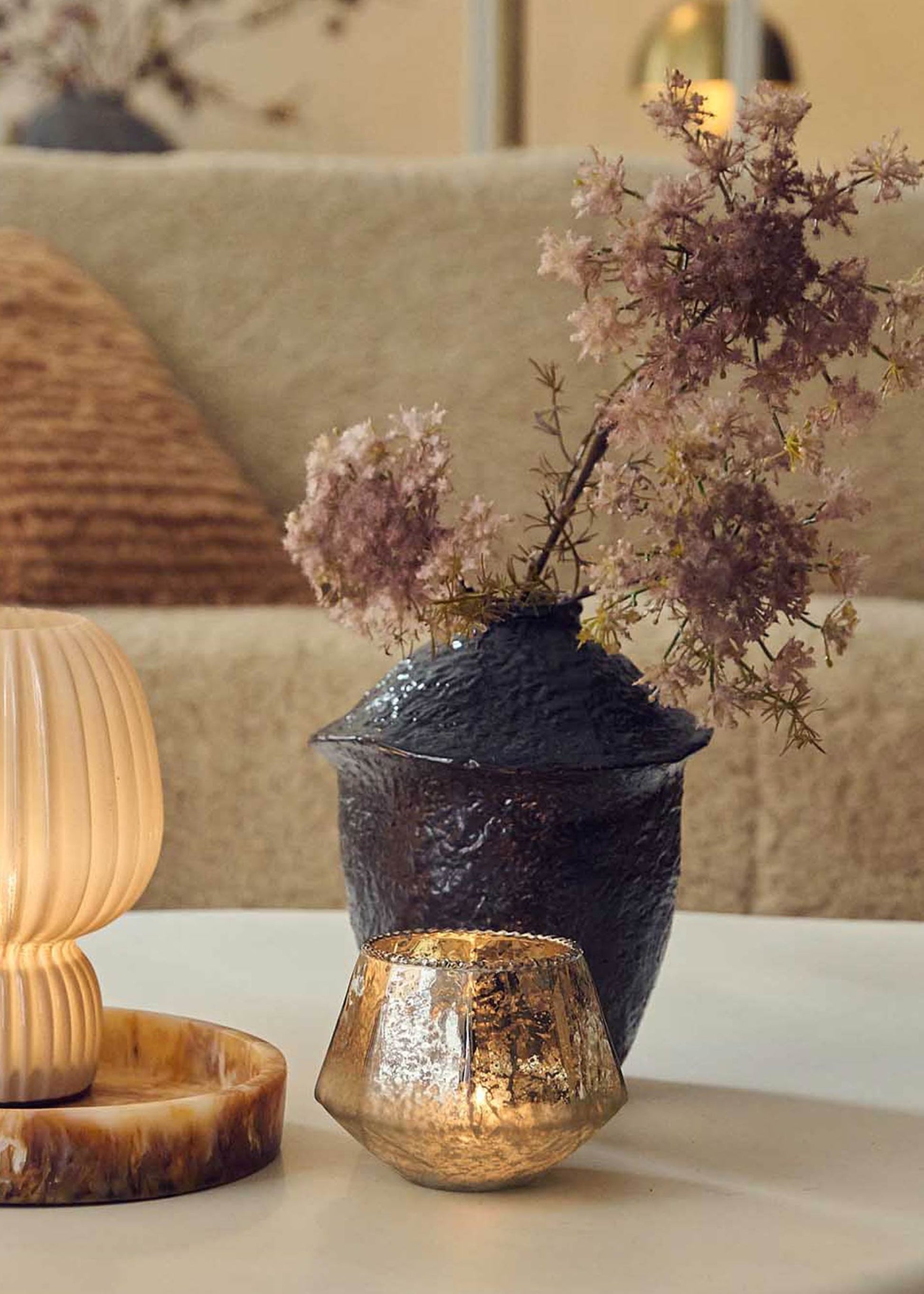 pink faux queen anne's lace arranged on coffee table