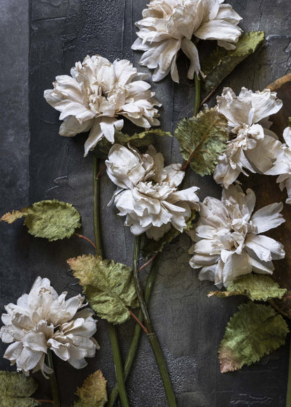 faux dahlias laying on a table