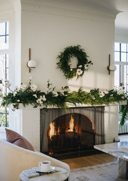 Magnolias in Mixed Evergreen Garlands on Mantel