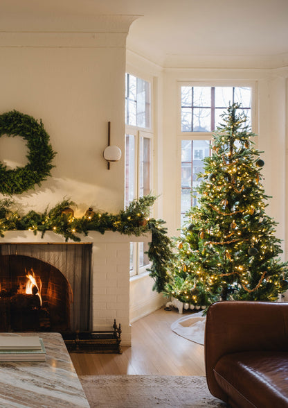 Artificial Christmas Tree in Living Room with Faux Wreath and Garland