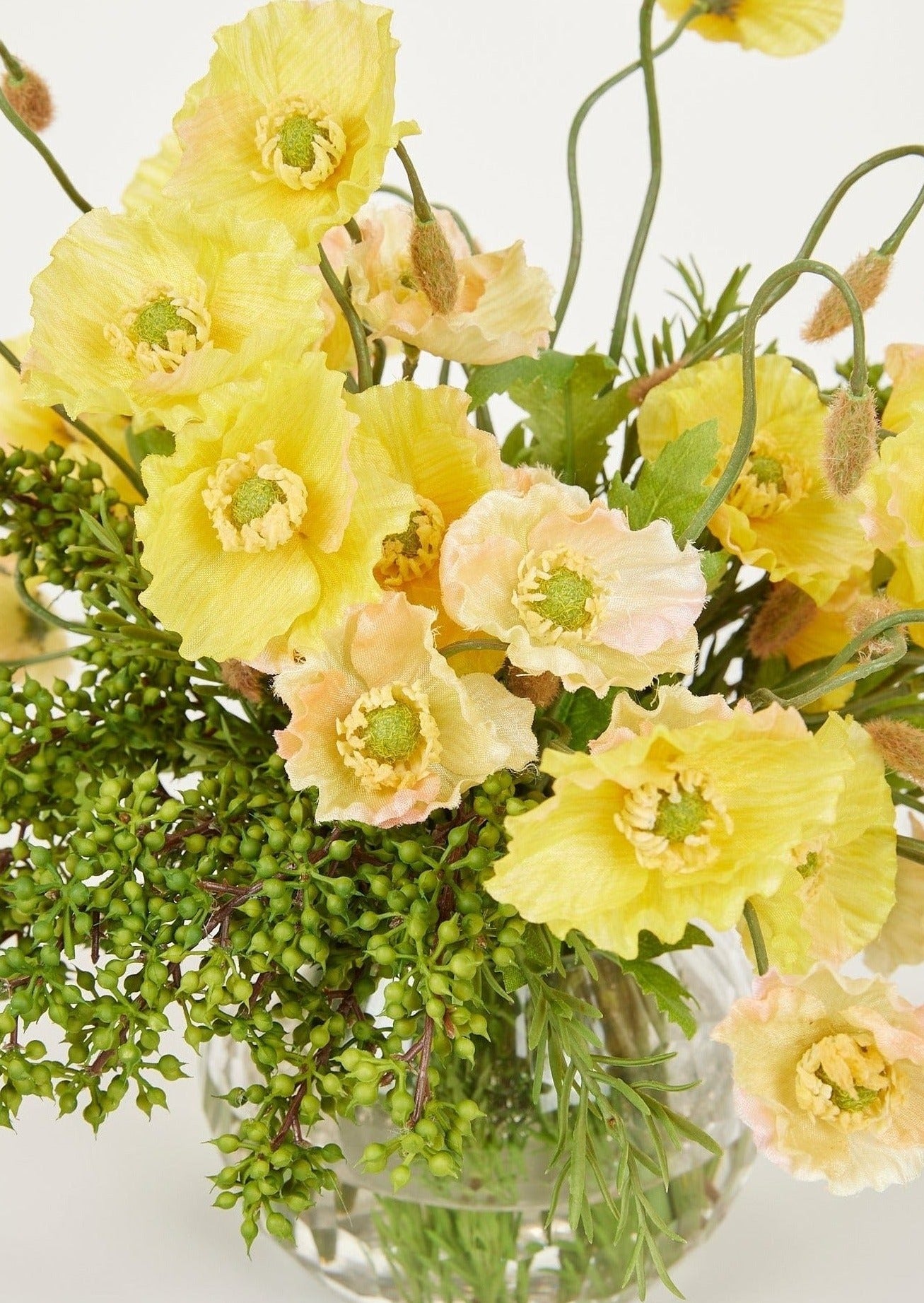 Afloral Closeup of Faux Yellow and Peach Poppies in Glass Vase Arrangement