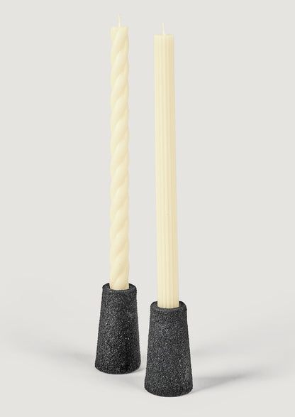 Cream Taper Candles Styled in Black Pumice Candle Holders at Afloral