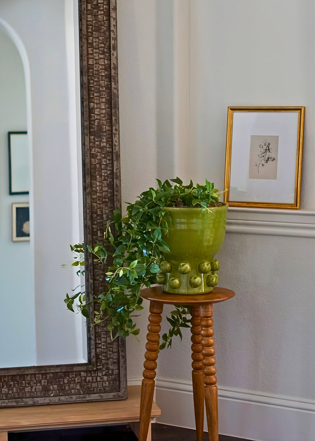 artificial tradescantia plant in green hobnail pot