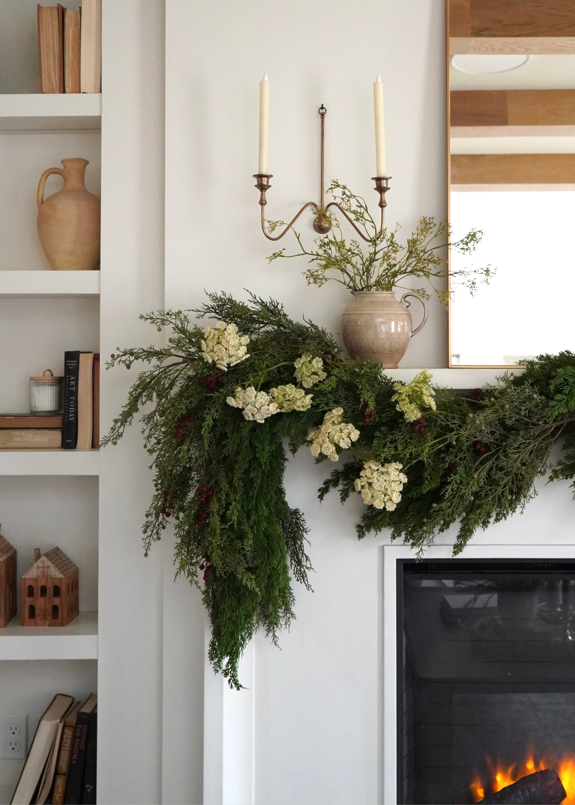 cedar garland on mantel with faux dill and red berry accents